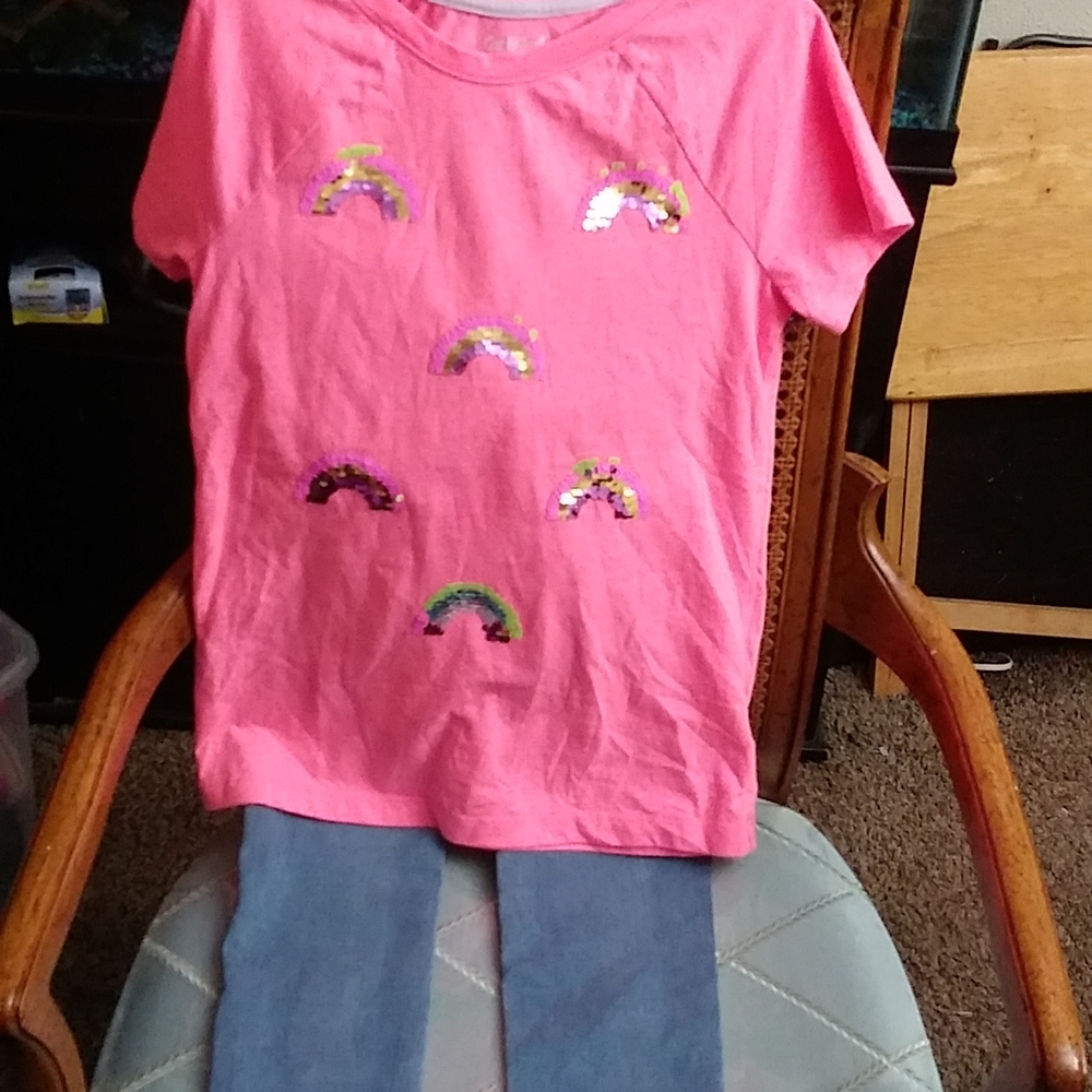 A 2 piece shirt and pants are both a size 10/12. Used